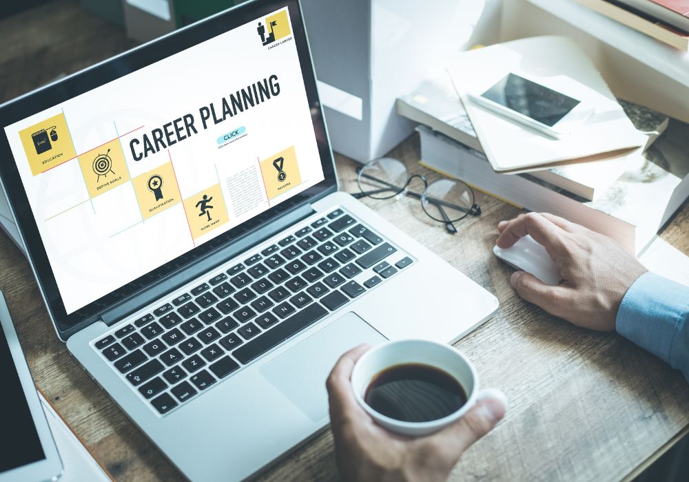 A laptop on the table with an opened presentation about career path planning